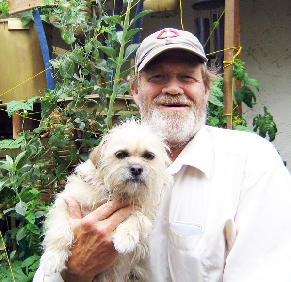 TC stands holding Precious the Pet Writes Pup